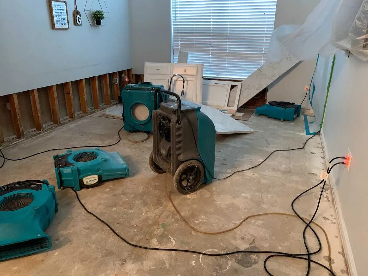 Dehumidifier in flood-cut room for Water Damage Restoration in Cranston